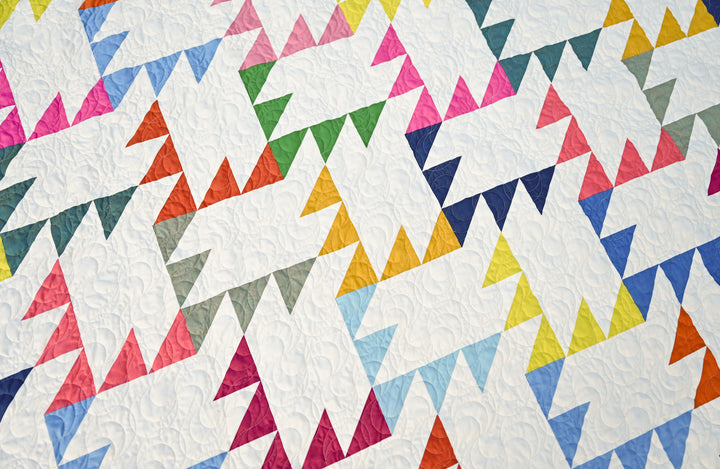 Jenny Quilt Pattern using Warp and Weft Hue solids fabrics in vibrant colors